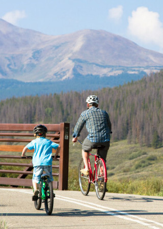 Father and Son biking together.