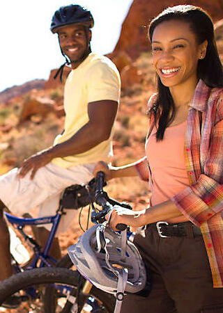 Couple biking in the Las Vegas sun.