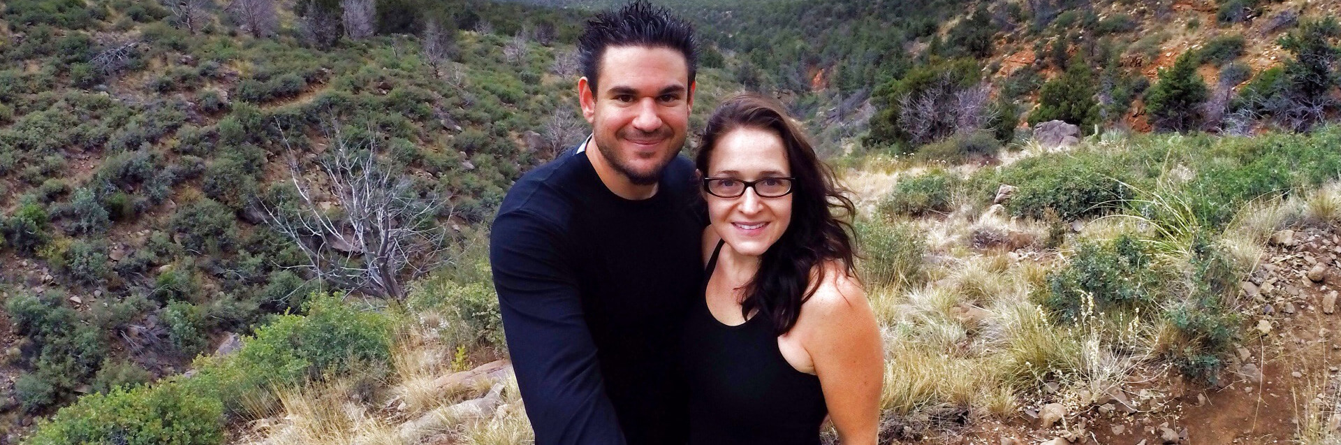 Couple hiking on a trail in Sedona wilderness.