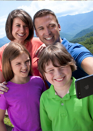 Family taking a selfie on vacation.